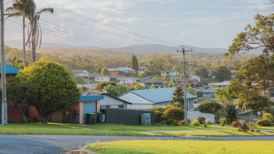 Quiet suburban neighborhood with modest houses at sunset