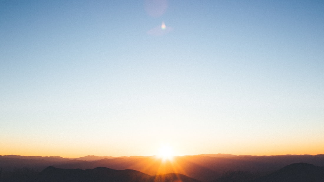 Golden sunrise over a mountain range